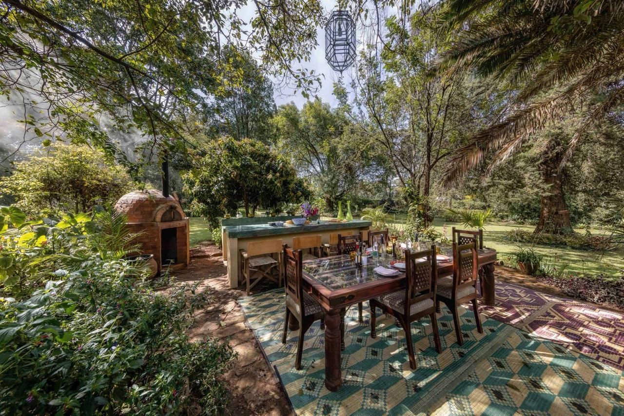 The outdoor bar and dining table beside the pizza oven